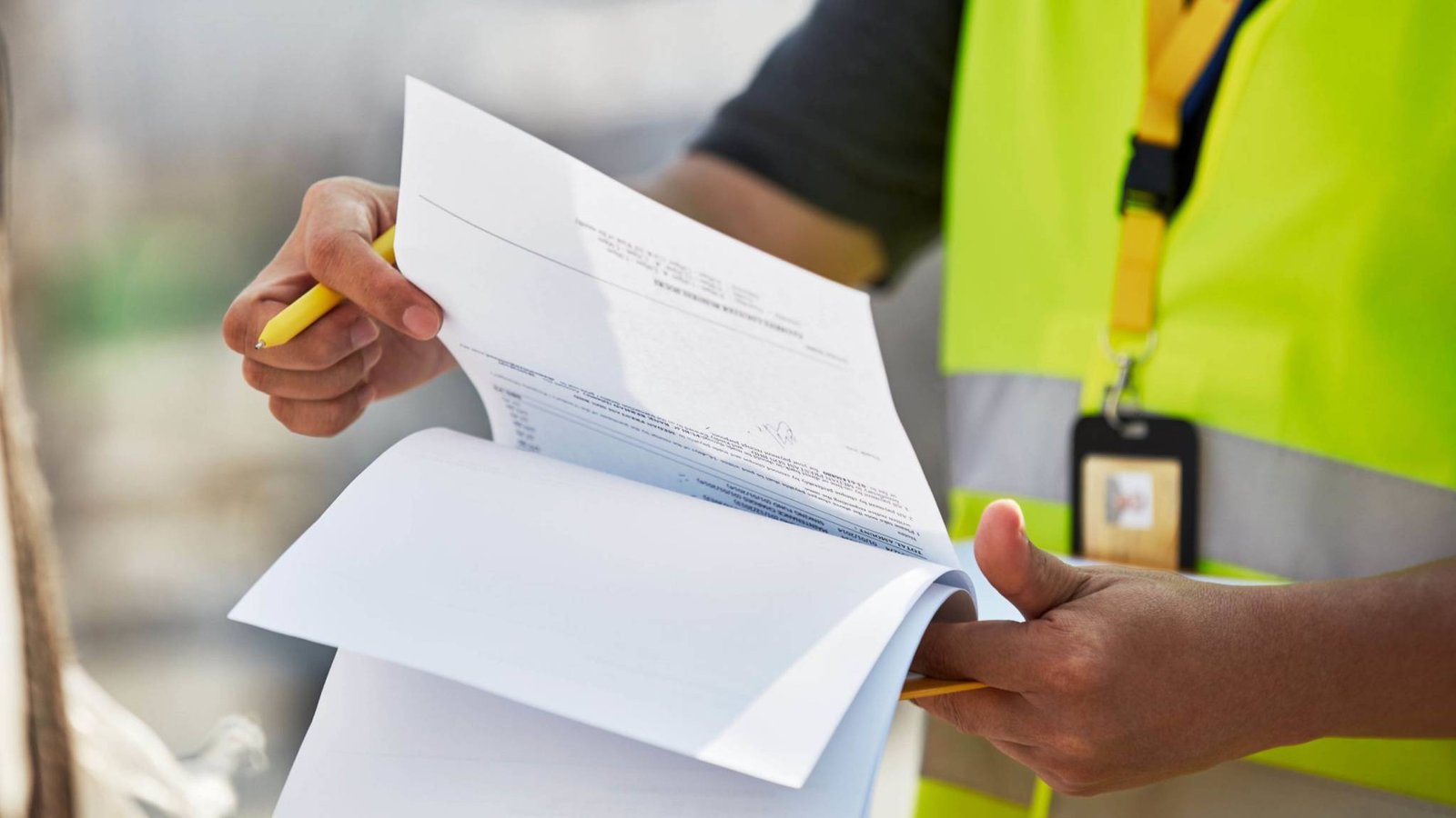 Customs clearance officer reviewing import-export documents with client