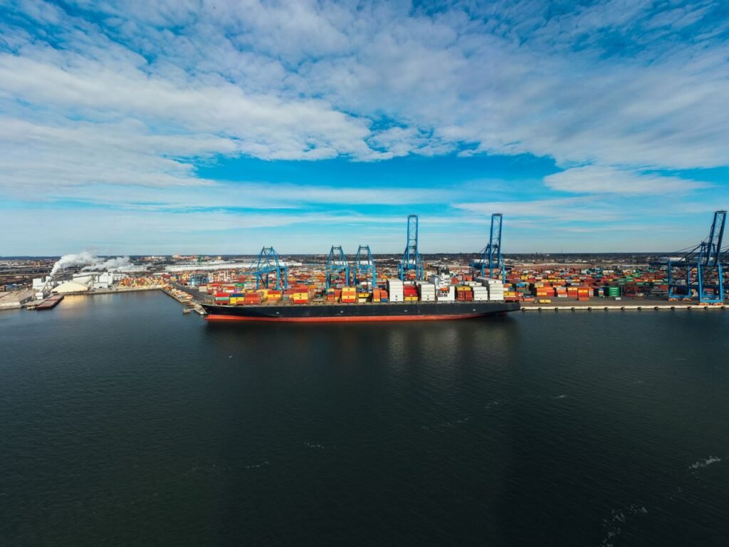 Container ship moored at a busy cargo port