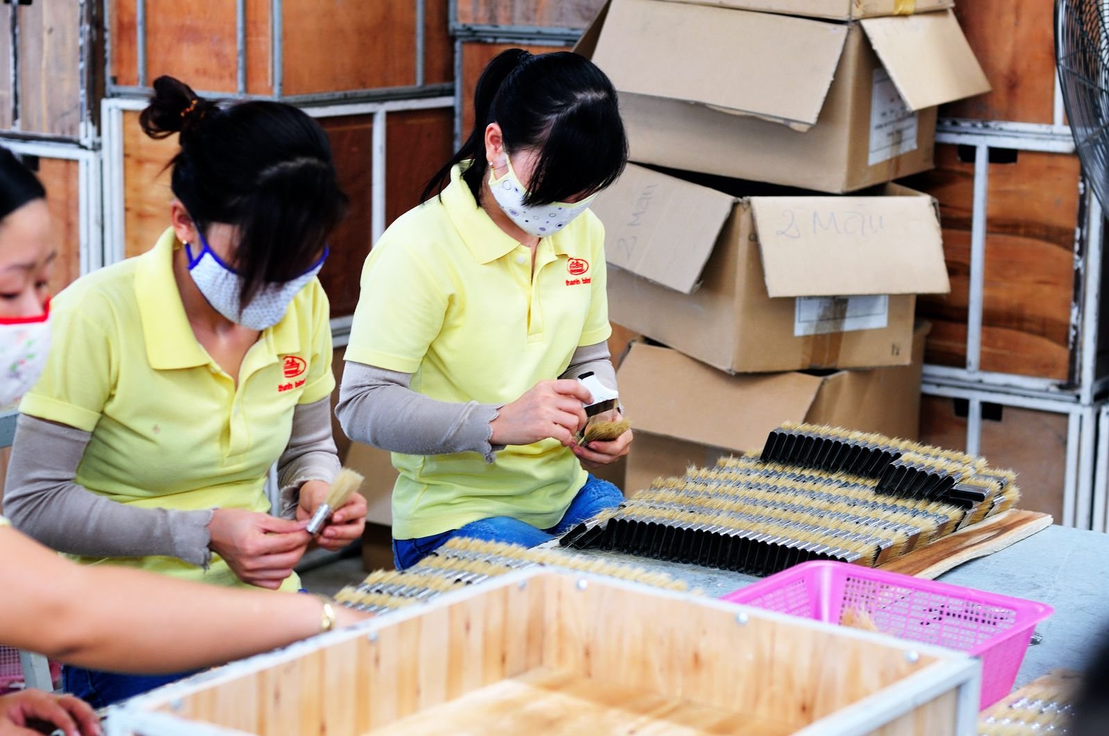 Workers packing products in a factory