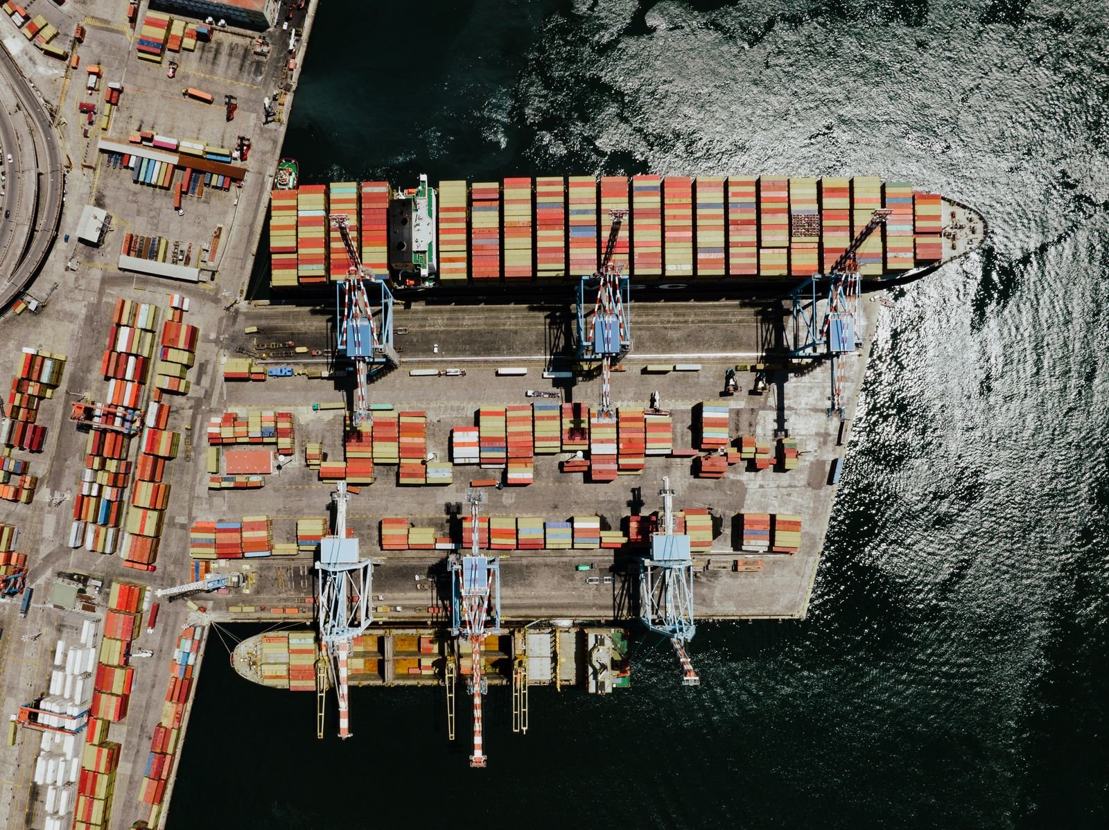Aerial view of a container ship at a busy port