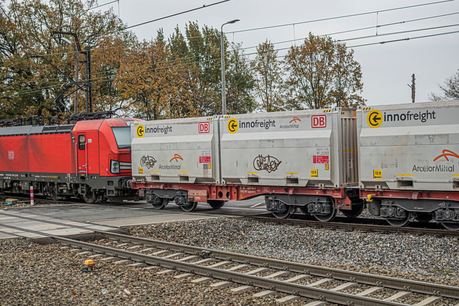 Freight train carrying containers on railway tracks