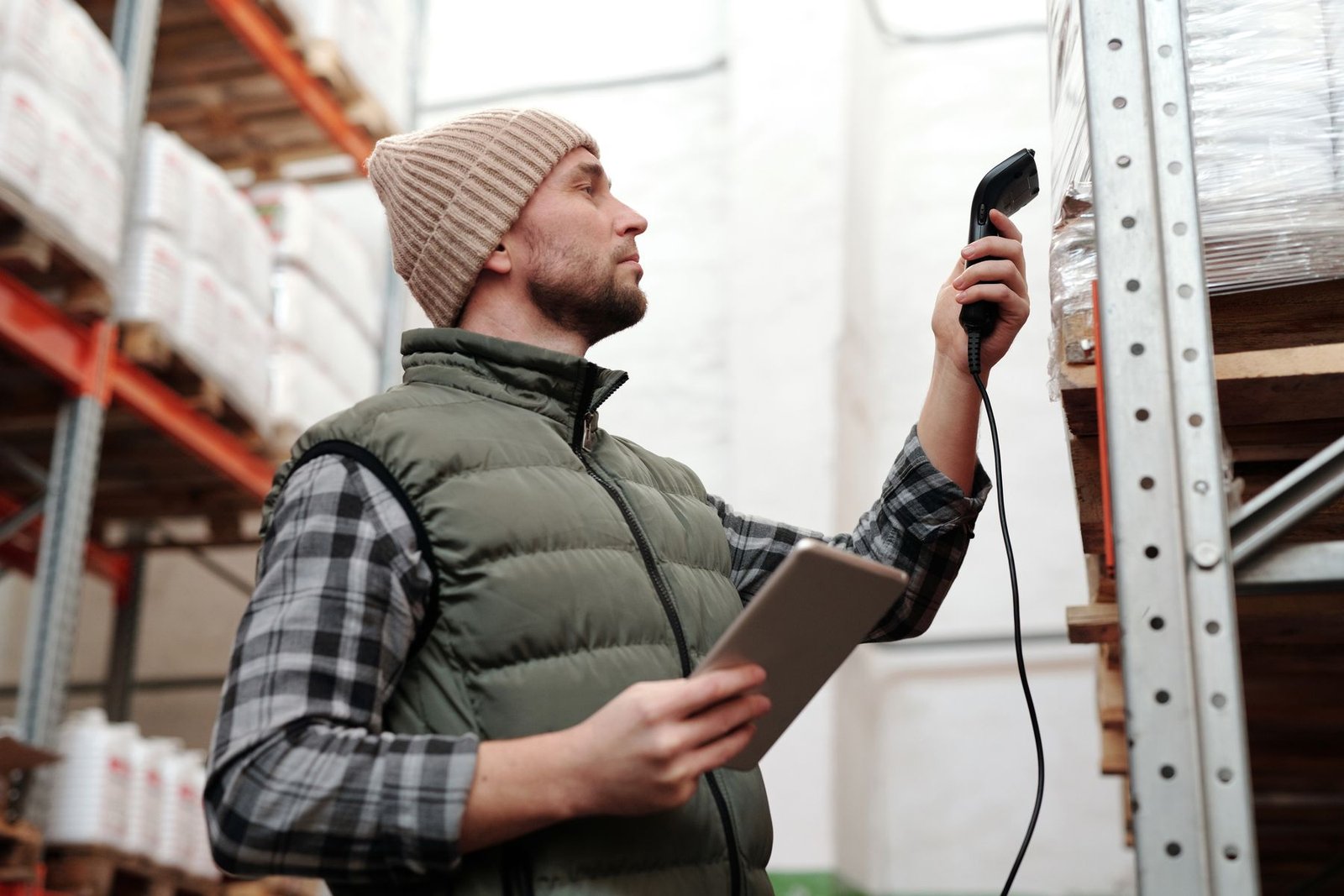 Man scanning products in a warehouse for HS code classification