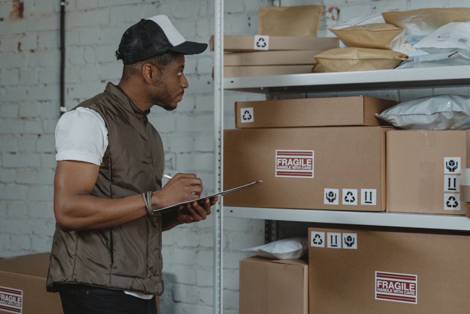 Man checking boxes ready for delivery