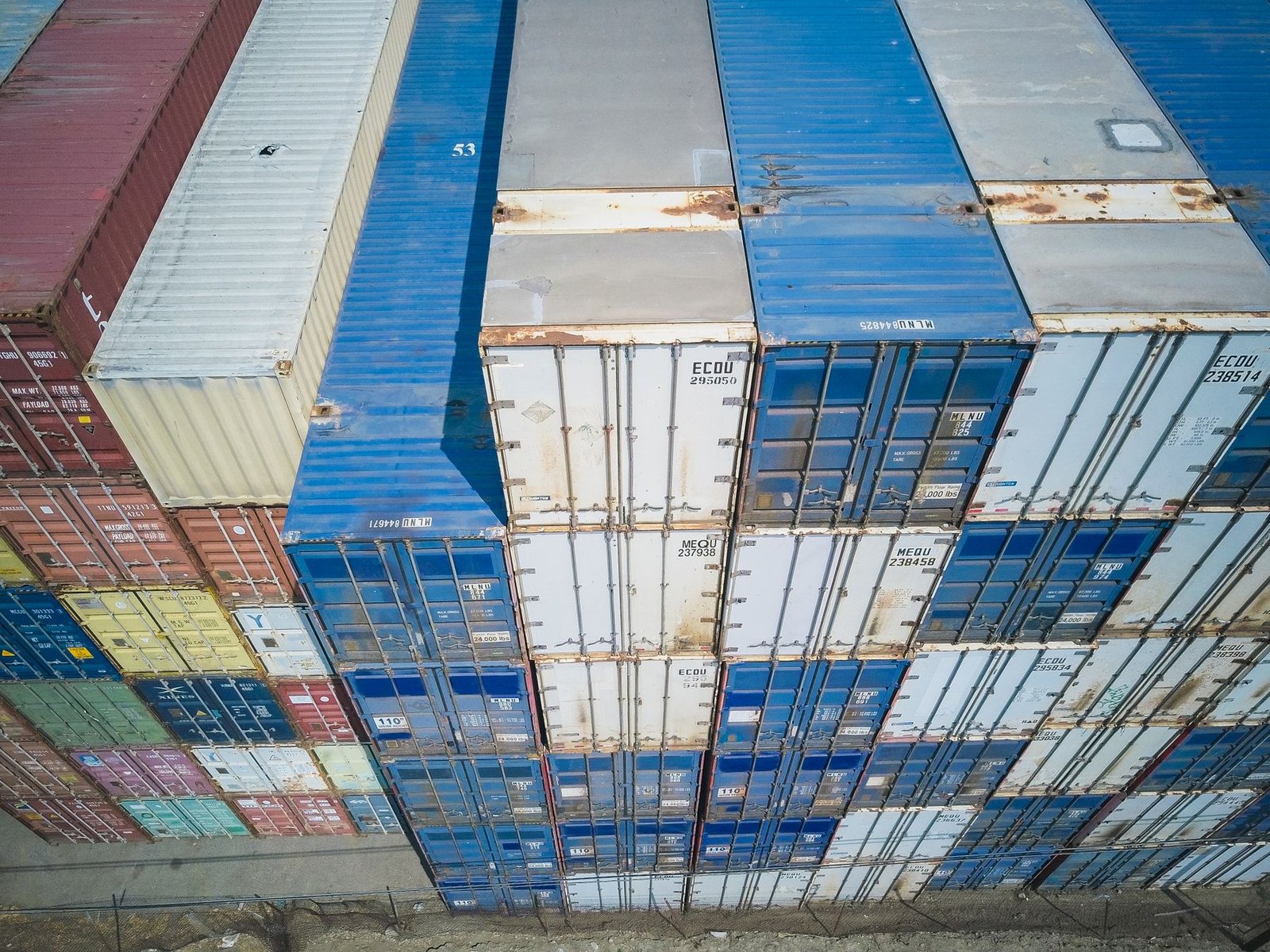 Drone shot of stacks of cargo containers at a container terminal