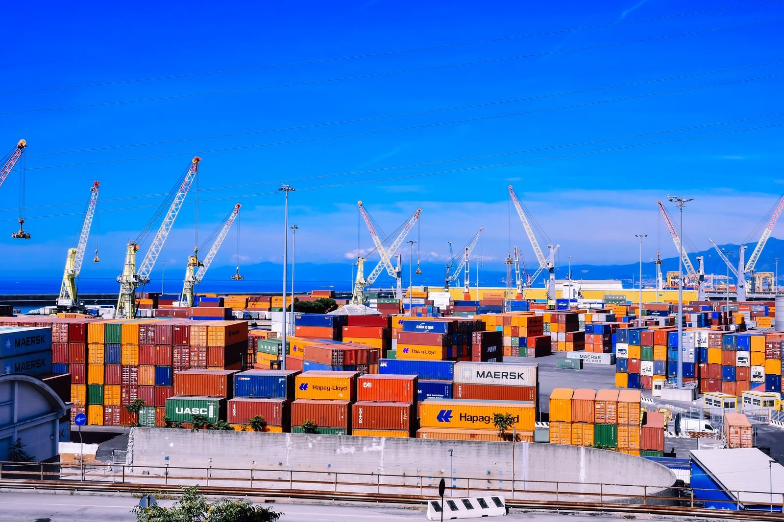 Port with shipping containers and cranes
