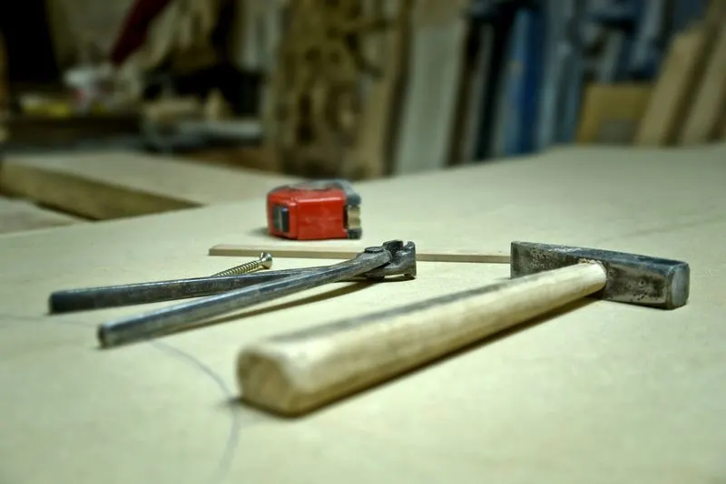 Hammer, pincers and screw