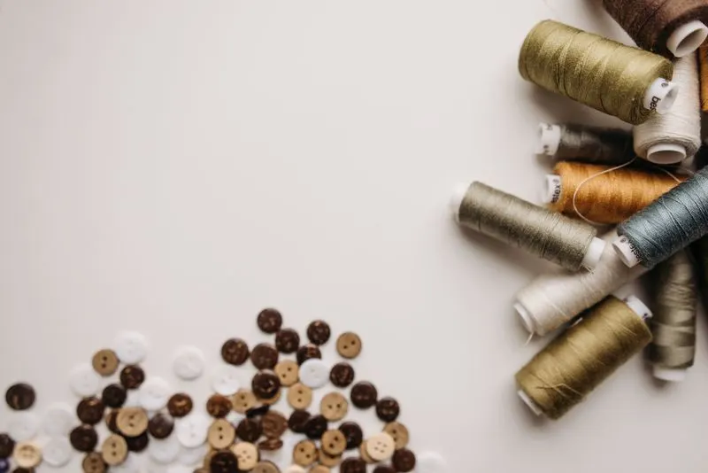 Sewing threads beside buttons